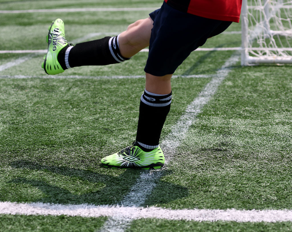 Blake Nichols of Ashland begins play with a corner kick